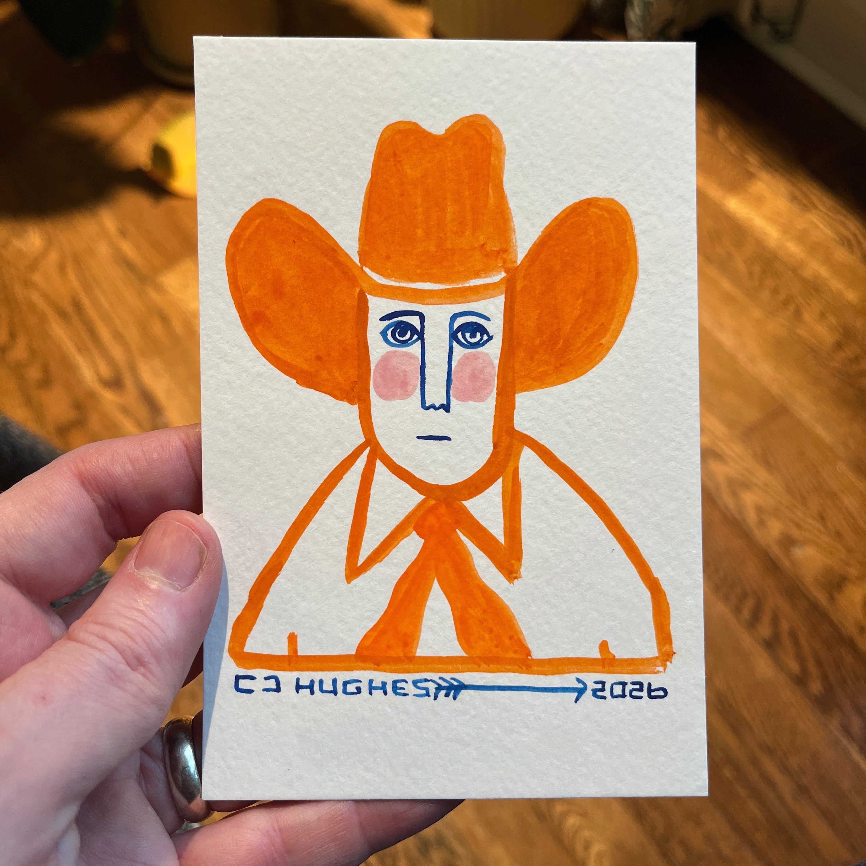 hand painted illustration in orange of a man wearing a large cowboy hat
